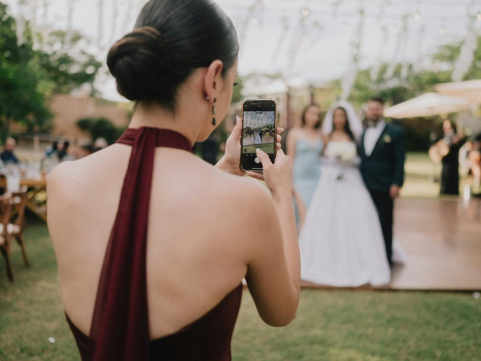 wedding content creator taking content of wedding couple