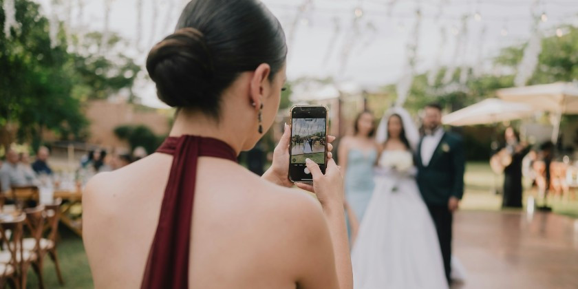 wedding content creator taking content of wedding couple