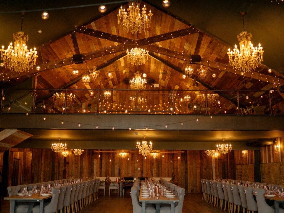Inside of barn venue, seating and balcony