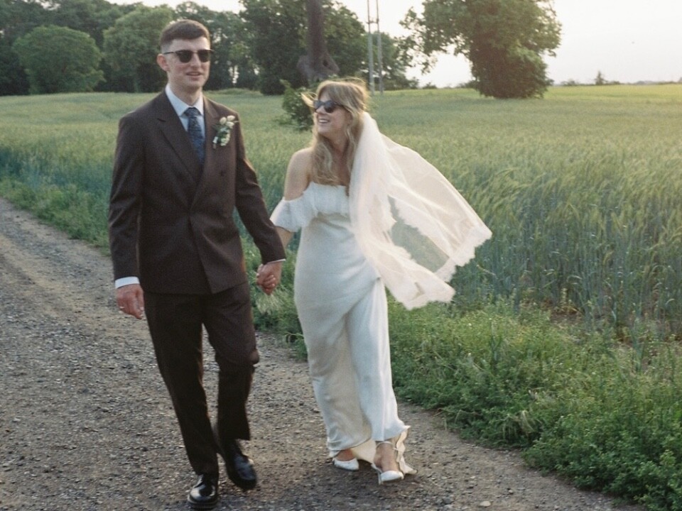 Bride and Groom walking in the gardens of Stockton house venue on their wedding day