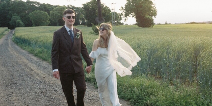 Bride and Groom walking in the gardens of Stockton house venue on their wedding day