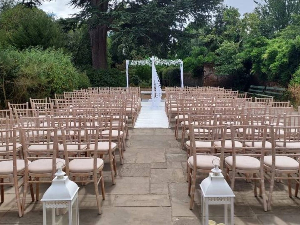 Exterior of Barn venue in daylight with ceremony area