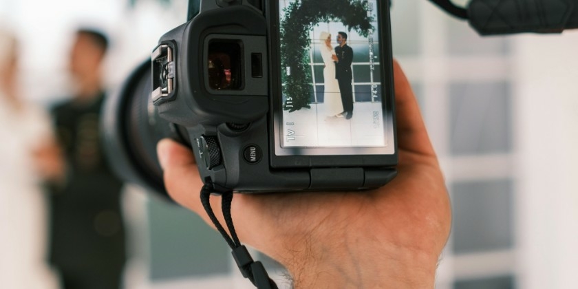 Wedding Photographer Taking A Photo Of the Bride and Groom