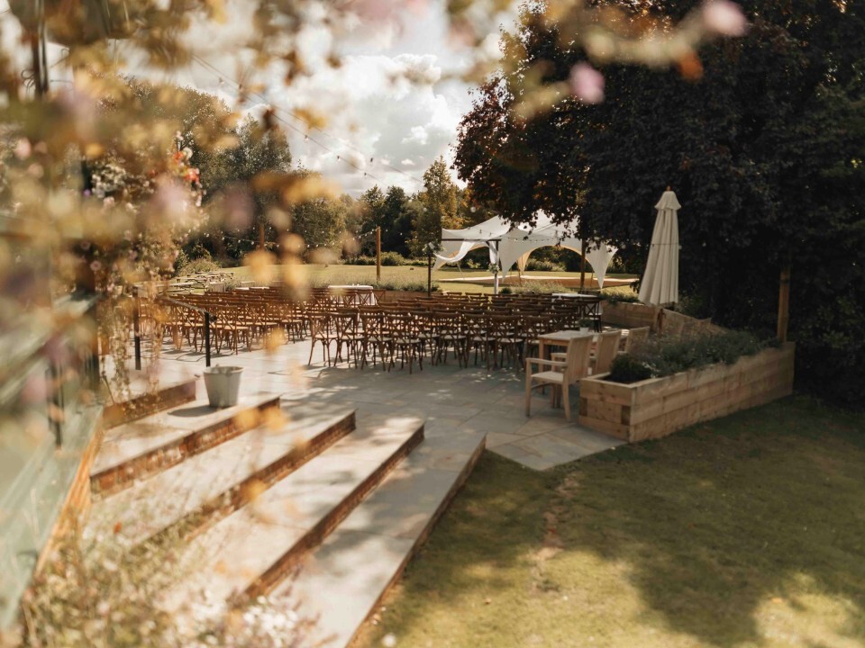 Garden wedding venue with outdoor ceremony setup and seating