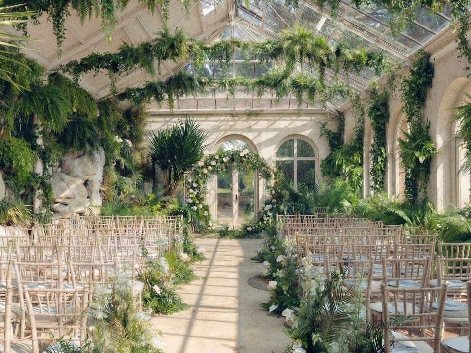 Botanical Glasshouse wedding ceremony space at Duke’s Yard at Ashridge House with tropical greenery and natural light