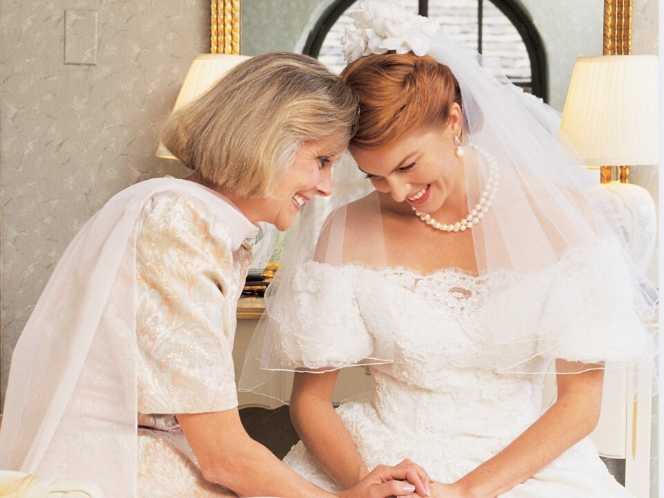 A mother and a bride embracing
