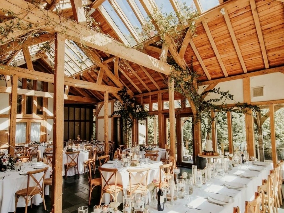 barn wedding venue wedding breakfast with wooden, light interior