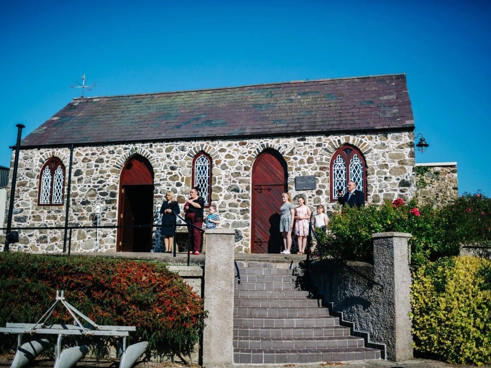 Exterior of Barn venue in daylight with guests