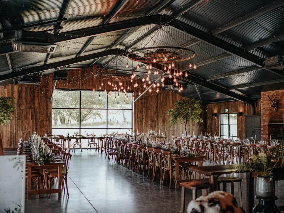 Silchester Farms industrial style barn space set for a wedding breakfast