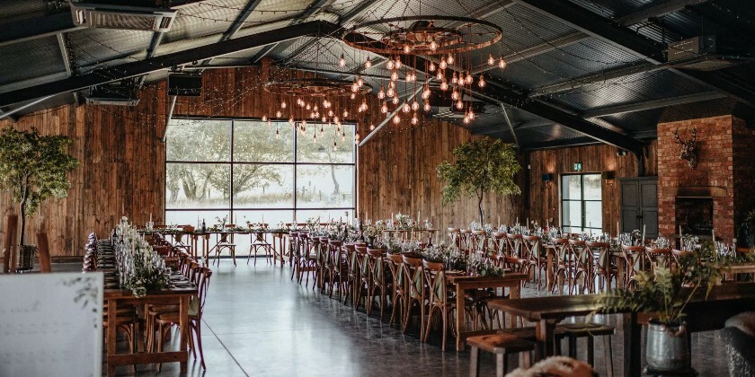 Silchester Farms industrial style barn space set for a wedding breakfast