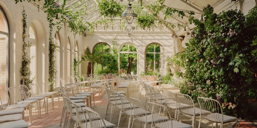 Botanical Glasshouse wedding ceremony space at Duke’s Yard at Ashridge House with tropical greenery and natural light