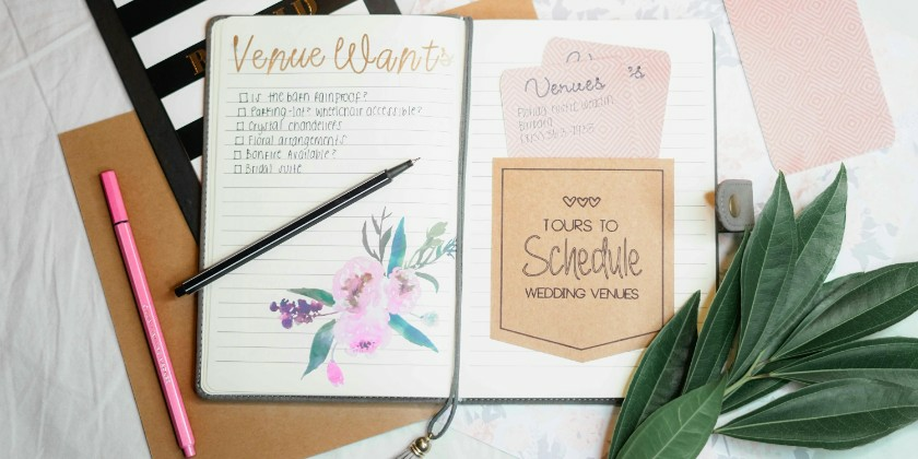 Wedding Planning Notebooks Aesthetically Placed On A Table