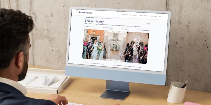 Business owner using Guides for Brides on their desktop. They are looking at a listing on screen.