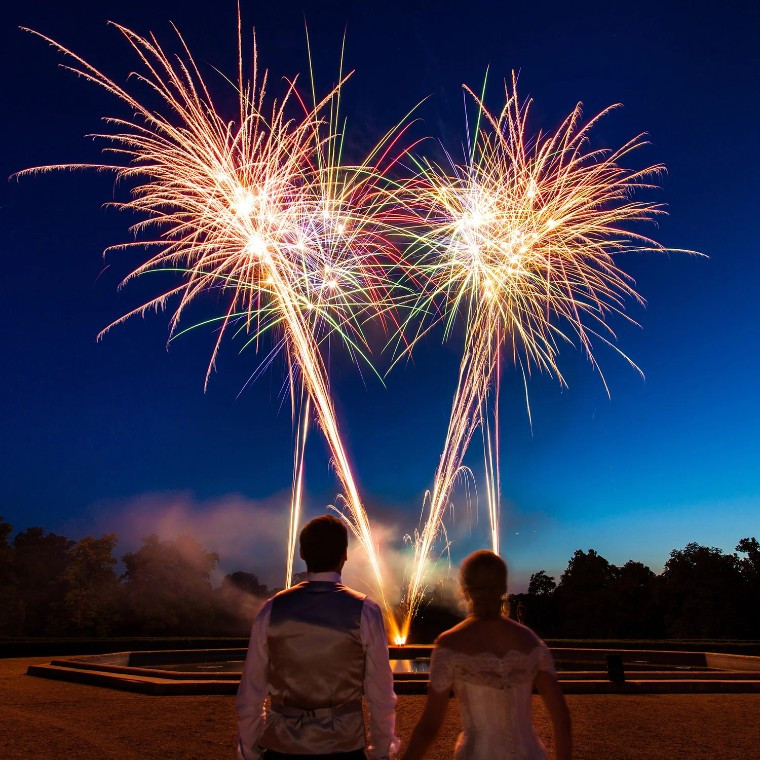 Couple watching fireworks at their wedding by Star Fireworks