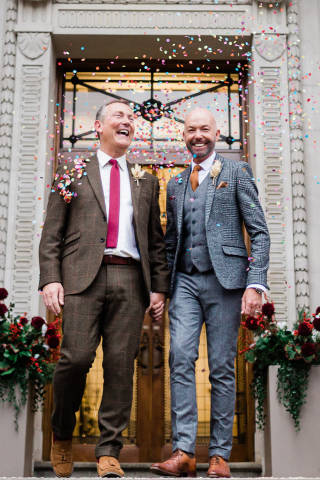 Grooms being showered in confetti at Old Marylebone Town Hall civil partnership