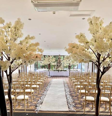 Golden Themed Wedding With Indoor Trees at Bron Eifion Hotel and Wedding Venue