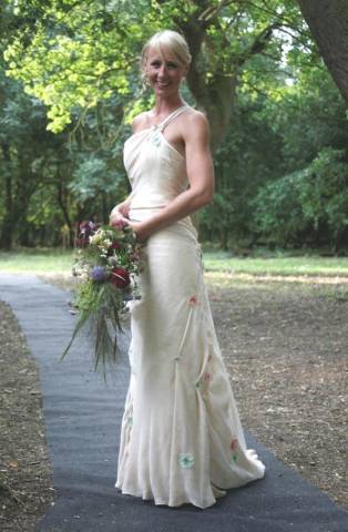 One shouldered bespoke cream chiffon wedding dress with embroidered flower applique by Rachel Lamb Design near Ely in Cambridgeshire