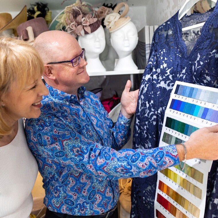 Simon Meanwell-Ralph, Winchester Millinery Designer, advising a Mother of the Bride on colour matching bespoke wedding hats at Marvellous Millinery’s Rose Garden Studio in Hampshire.
