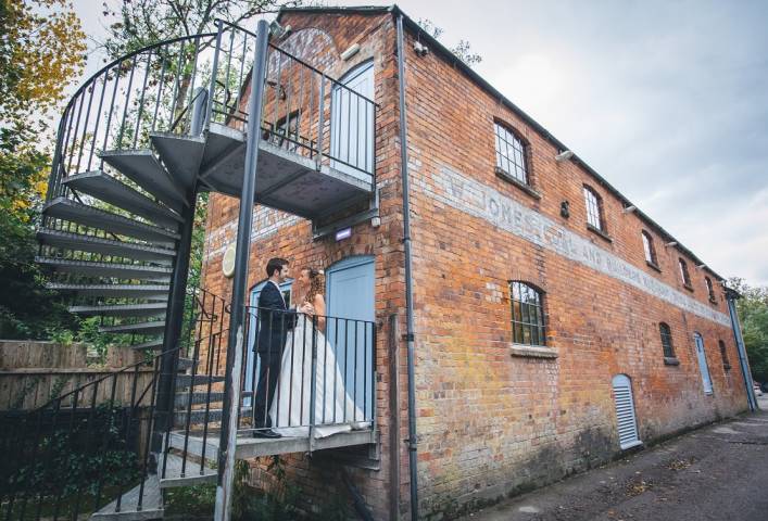Couple on spiral steps outside Egypt Mill