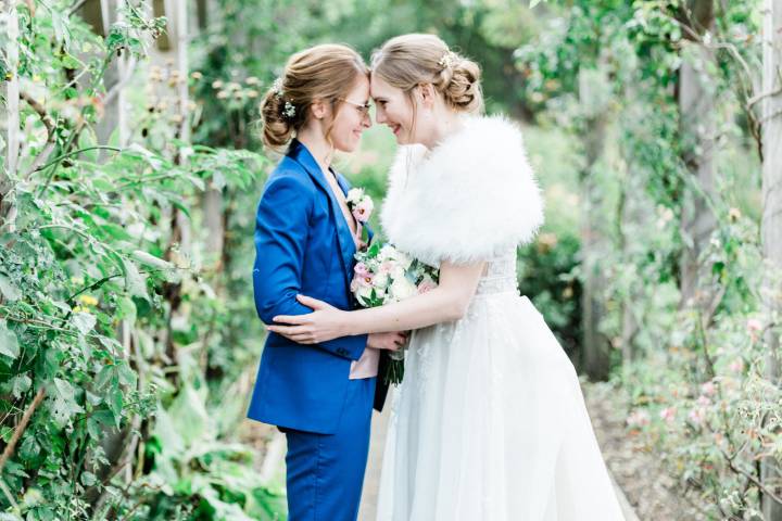 Romantic shot of two brides at same sex wedding Richmond London