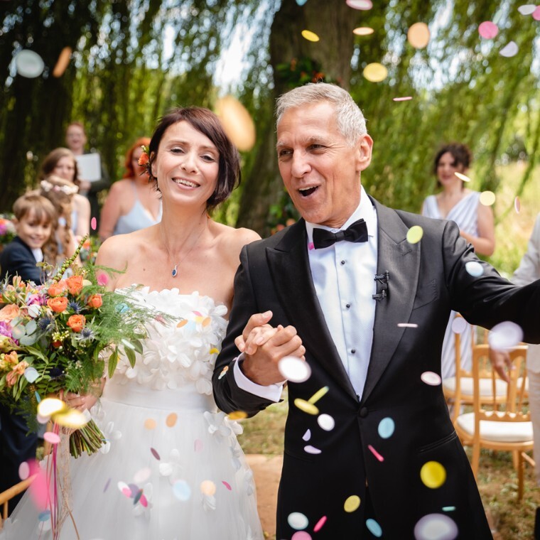 a confetti shot of a bride and groom