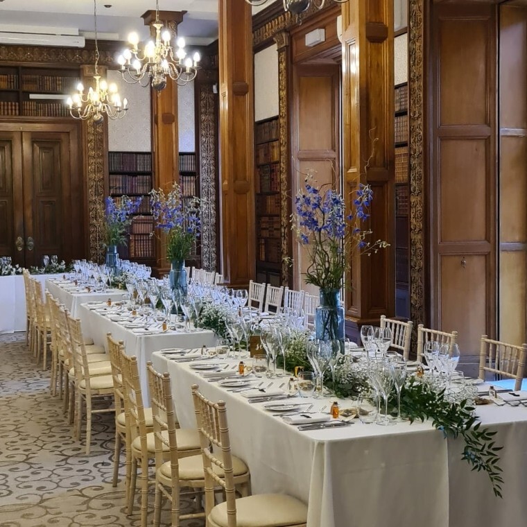 Elegant wedding tablescape with refined floral centrepieces and considered styling, designed to enhance atmosphere and guest experience