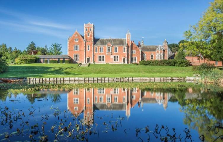 Thicket Priory reflected in the water