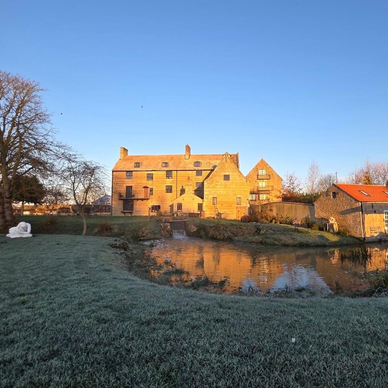 Grade 2 Listed Mill House bathed in sunlight