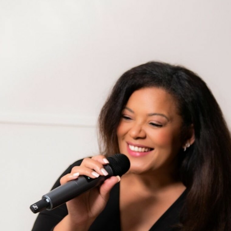 Tiffany Jackson holding a microphone 