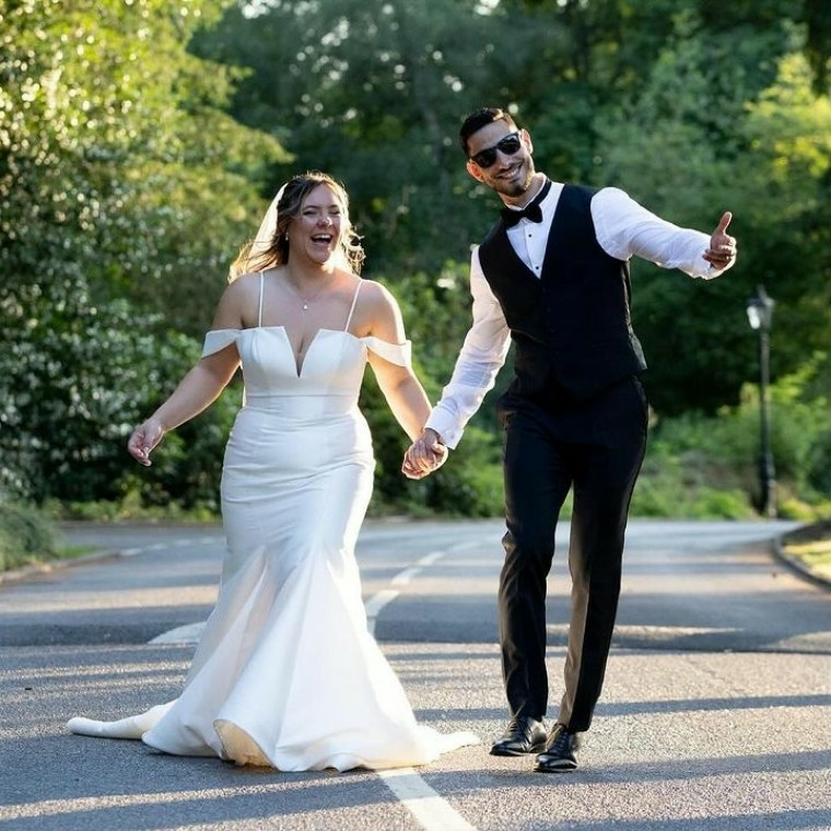 Bride and groom holding hands 