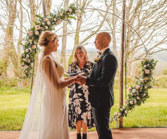 Celebrant Lisa with bride and groom at The Gate