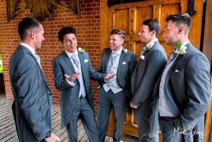 The guys pre wedding ceremony chat at The Dairy on The Waddesdon Estate