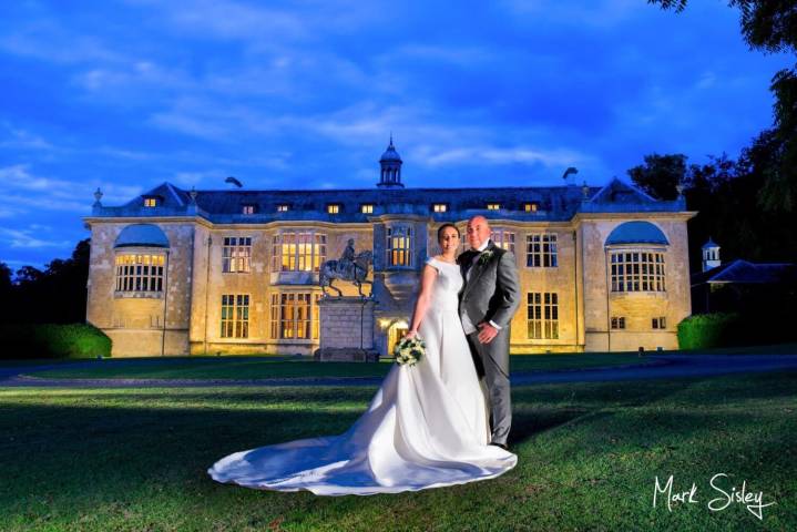 Hartwell House with a bride & groom at dusk