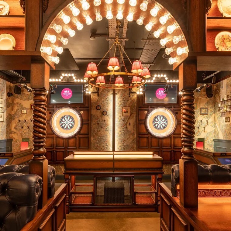 dartboards in a themed bar setting