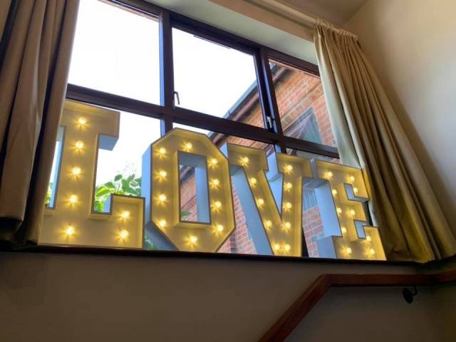Illuminated LOVE letters at East Horton Golf