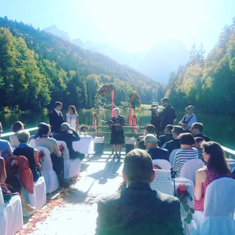 Wedding party on a raft sailing on a glacial lake in Germany.