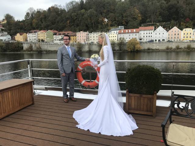Wedding couple on board a river cruise boat after their ceremony