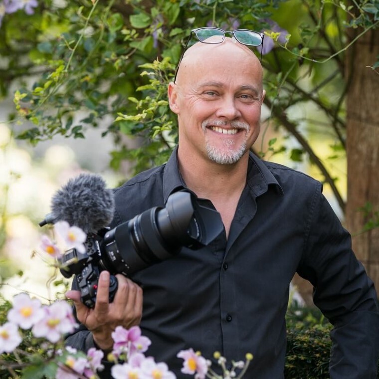 A photo of me filming at a wedding