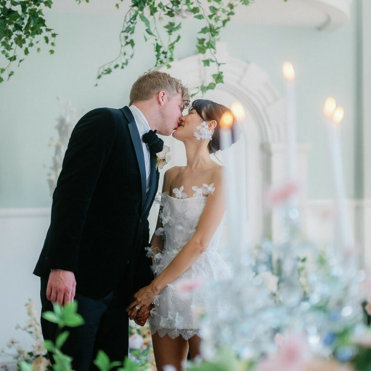 Lucia Penman Events, luxury wedding planner in UK, styling an elegant serpentine wedding table with seasonal flowers