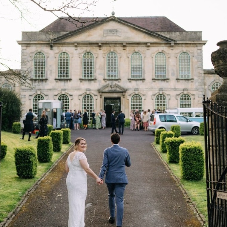 wedding venue front facard with bride and groom
