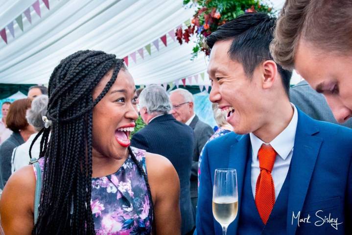 Buckinghamshire marquee wedding guests laughing