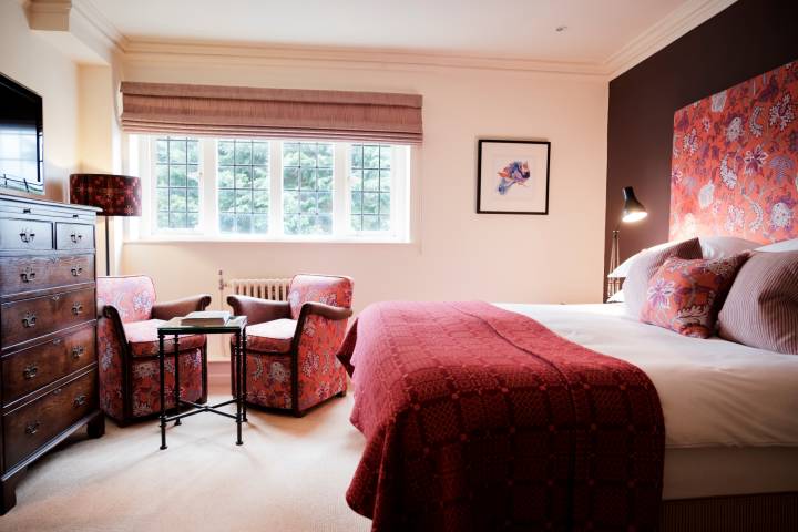 A bedroom inside The Bear of Rodborough Hotel in Gloucestershire