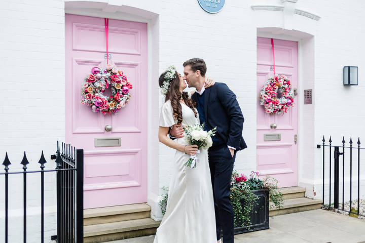 Bride and groom kissing outside Turner Studios, Chelsea