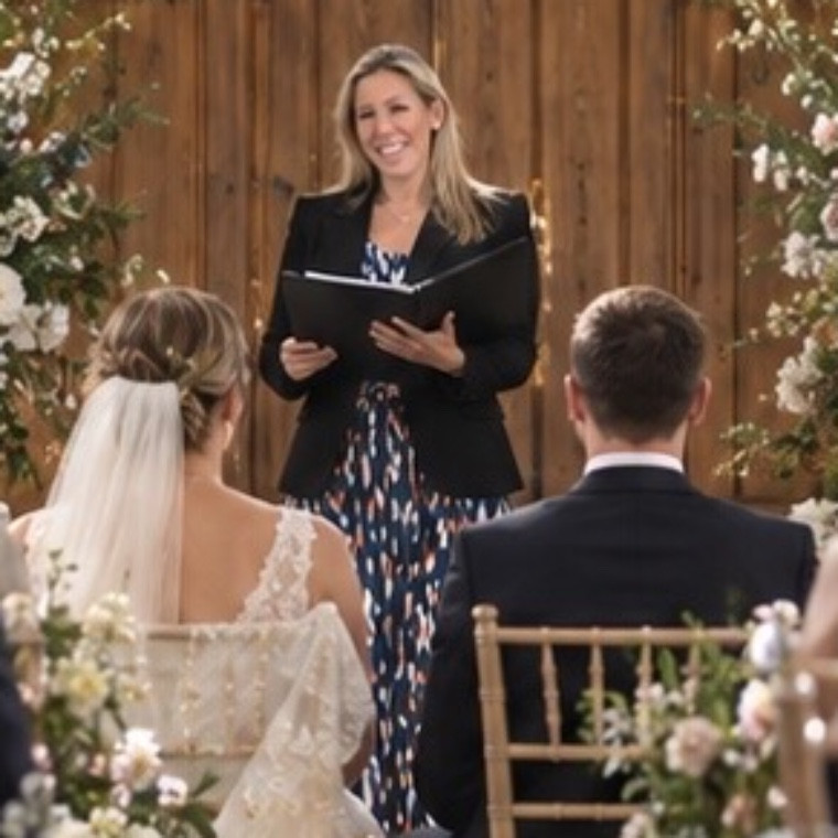 Helen Wilde conducting a indoor wedding.
