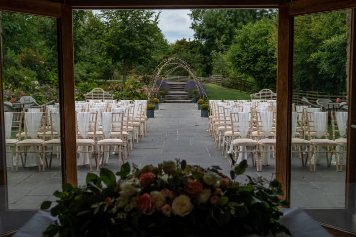 Wedding ceremony in the garden at the Barns at Wick Farm Bath
