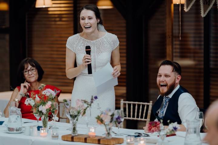 A bride giving a speech at Voco Oxford Thames