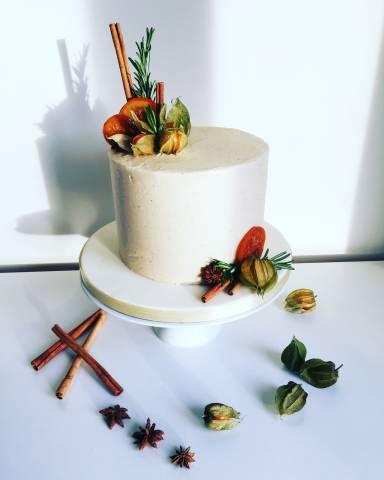 Modern style naked carrot wedding cake with natural decorations