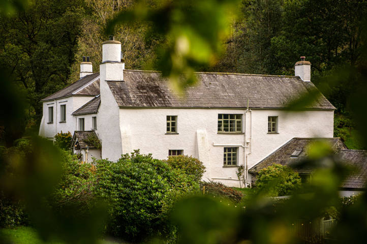 Rustic White Building Around Tall Treees, Cote How Lakeland Wedding Venue