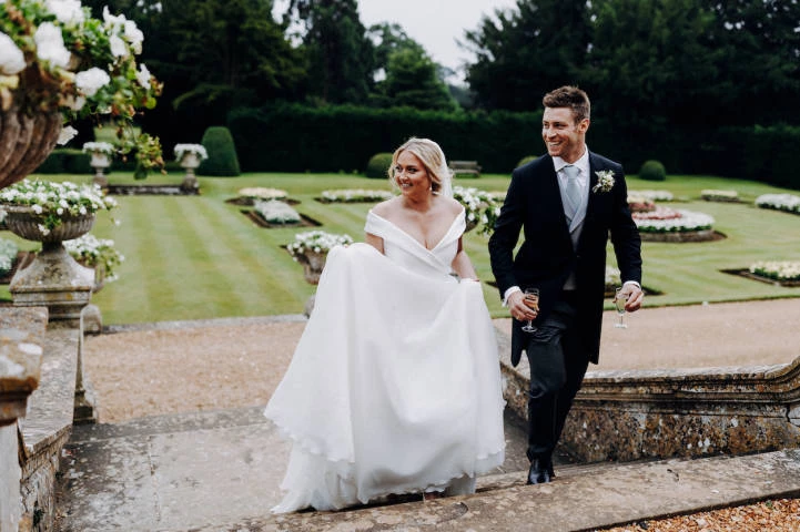 Couple Walking Up Stairs of Garden in Grittleton House, Venues in Chippenham, Wiltshire