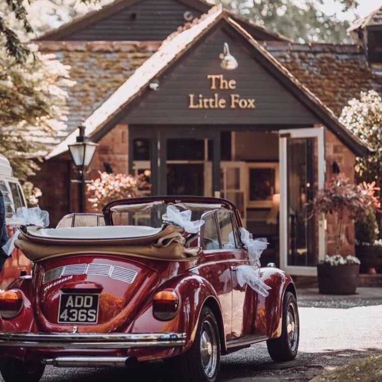 Image of a Beetle wedding car outside The Little Fox Pub Wedding Venue in Merseyside